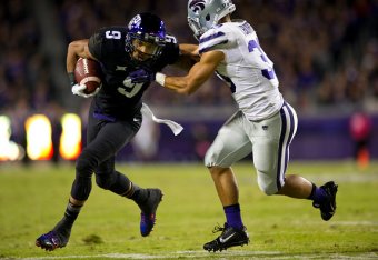FORT WORTH, TX - NOVEMBER 8:  Josh Doctson #9 of the TCU Horned Frogs is wrapped up by Morgan Burns #33 of the Kansas State Wildcats during the 1st quarter on November 8, 2014 at Amon G. Carter Stadium in Fort Worth, Texas.  (Photo by Cooper Neill/Getty I