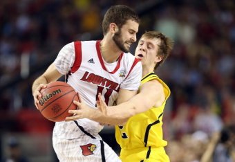 ATLANTA, GA - APRIL 08:  Spike Albrecht #2 (R) of the Michigan Wolverines defends against Luke Hancock #11 of the Louisville Cardinals during the 2013 NCAA Men's Final Four Championship at the Georgia Dome on April 8, 2013 in Atlanta, Georgia.  (Photo by 