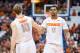 SYRACUSE, NY - NOVEMBER 16: Trevor Cooney #10 of the Syracuse Orange congratulates teammate Michael Gbinije #0 for a drawing the foul and a basket on the previous play against the Hampton Pirates on November 16, 2014 at The Carrier Dome in Syracuse, New