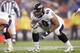 DENVER - OCTOBER 9: Jason Brown #60 of the Baltimore Ravens gets ready on the line of scrimmage during the game against the Denver Broncos on October 9, 2006 at Invesco Field at Mile High in Denver, Colorado. The Broncos won 13-3. (Photo by Brian Bahr/