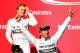 AUSTIN, TX - NOVEMBER 02: Lewis Hamilton of Great Britain and Mercedes GP celebrates on the podium next to Nico Rosberg of Germany and Mercedes GP following his victory in the United States Formula One Grand Prix at Circuit of The Americas on November 2,