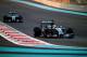 ABU DHABI, UNITED ARAB EMIRATES - NOVEMBER 23: Lewis Hamilton of Great Britain and Mercedes GP leads Nico Rosberg of Germany and Mercedes GP a during the Abu Dhabi Formula One Grand Prix at Yas Marina Circuit on November 23, 2014 in Abu Dhabi, United Ara