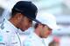 ABU DHABI, UNITED ARAB EMIRATES - NOVEMBER 23: Lewis Hamilton of Great Britain and Mercedes GP and Nico Rosberg of Germany and Mercedes GP attend a team photograph before the Abu Dhabi Formula One Grand Prix at Yas Marina Circuit on November 23, 2014 in