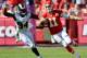 KANSAS CITY, MO - OCTOBER 26: Alex Smith #11 of the Kansas City Chiefs runs the ball against Robert Quinn #94 of the St. Louis Rams at Arrowhead Stadium on October 26, 2014 in Kansas City, Missouri. (Photo by Peter Aiken/Getty Images)