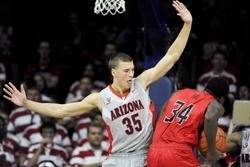 Dec 2, 2014; Tucson, AZ, USA; Arizona Wildcats center Kaleb Tarczewski (35) defends Gardner Webb Runnin Bulldogs forward Jerome Hill (34) during the second half at McKale Center. Arizona won 91-65. Mandatory Credit: Casey Sapio-USA TODAY Sports