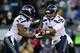 PHILADELPHIA, PA - DECEMBER 07: Quarterback Russell Wilson #3 of the Seattle Seahawks hands the ball off to Marshawn Lynch #24 in the first quarter against the Philadelphia Eagles at Lincoln Financial Field on December 7, 2014 in Philadelphia, Pennsylva