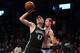 Nov 7, 2014; Brooklyn, NY, USA; Brooklyn Nets small forward Andrei Kirilenko (47) grabs a rebound in front of New York Knicks small forward Travis Wear (6) during the fourth quarter at Barclays Center. The Nets defeated the Knicks 110-99. Mandatory Credit