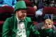 CLEVELAND - MARCH 17: A man dressed as a leprechaun sits next to a young boy during the Cleveland Cavaliers game against the Portland Trail Blazers on March 17, 2006 at Quicken Loans Arena in Cleveland, Ohio. The Cavs won 99-84. NOTE TO USER: User expre
