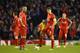 LIVERPOOL, ENGLAND - DECEMBER 09: (R-L) Dejected Liverpool players Rickie Lambert and Steven Gerrard look on after conceding the opening goal during the UEFA Champions League group B match between Liverpool and FC Basel 1893 at Anfield on December 9, 2014