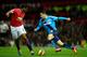 MANCHESTER, ENGLAND - DECEMBER 02: Oussama Assaidi of Stoke City competes with Antonio Valencia of Manchester United during the Barclays Premier League match between Manchester United and Stoke City at Old Trafford on December 2, 2014 in Manchester, Engl