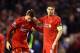 LIVERPOOL, ENGLAND - DECEMBER 09: (L-R) Dejected Liverpool players Jordan Henderson and Steven Gerrard react following their team's 1-1 draw and exit from the competition during the UEFA Champions League group B match between Liverpool and FC Basel 1893