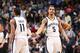 MEMPHIS, TN - APRIL 9: Mike Conley #11 and Courtney Lee #5 of the Memphis Grizzlies shake hands against the Miami Heat on April 9, 2014 at FedExForum in Memphis, Tennessee. NOTE TO USER: User expressly acknowledges and agrees that, by downloading and or