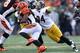 CINCINNATI, OH - DECEMBER 7: Lawrence Timmons #94 of the Pittsburgh Steelers reaches out to wrap up Giovani Bernard #25 of the Cincinnati Bengals during the third quarter at Paul Brown Stadium on December 7, 2014 in Cincinnati, Ohio. (Photo by Andy Lyons