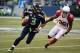 SEATTLE, WA - NOVEMBER 23: Russell Wilson #3 of the Seattle Seahawks runs the ball out of the pocket in the third quarter against Deone Bucannon #36 of the Arizona Cardinals during their game at CenturyLink Field on November 23, 2014 in Seattle, Washing