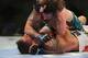 Apr 27, 2013; Newark, NJ, USA; Leonard Garcia (white shorts) competes against Cody McKenzie (green and black shorts) during UFC 159 at the Prudential Center. Mandatory Credit: Brad Penner-USA TODAY Sports