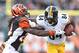 CINCINNATI, OH - DECEMBER 7: Adam Jones #24 of the Cincinnati Bengals attempts to tackle Antonio Brown #84 of the Pittsburgh Steelers during the fourth quarter at Paul Brown Stadium on December 7, 2014 in Cincinnati, Ohio. Pittsburgh defeated Cincinnati