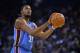 OAKLAND, CA - DECEMBER 18: Kevin Durant #35 of the Oklahoma City Thunder shoots a free throw against the Golden State Warriors at ORACLE Arena on December 18, 2014 in Oakland, California. NOTE TO USER: User expressly acknowledges and agrees that, by down