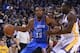 December 18, 2014; Oakland, CA, USA; Oklahoma City Thunder forward Kevin Durant (35) dribbles the basketball against Golden State Warriors forward Draymond Green (23) during the second quarter at Oracle Arena. The Warriors defeated the Thunder 114-109. Ma