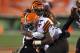 CINCINNATI, OH - NOVEMBER 6: Adam Jones #24 of the Cincinnati Bengals tackles Ben Tate #44 of the Cleveland Browns during the third quarter at Paul Brown Stadium on November 6, 2014 in Cincinnati, Ohio. (Photo by John Grieshop/Getty Images)