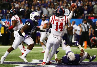 ATLANTA, GA - DECEMBER 31: Bo Wallace #14 of the Ole Miss Rebels throws under pressure by Marcus Mallet #54 and Paul Dawson #47, the ball was intercepted by James McFarland #40 of the TCU Horned Frogs for a touchdown in the second quarter during the Chik