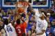 Nov 21, 2014; Lexington, KY, USA; Kentucky Wildcats forward Willie Cauley-Stein (15) and center Dakari Johnson (44) block the shot of Boston University Terriers guard Eric Fanning (3) in the second half at Rupp Arena. Kentucky defeated Boston University 8
