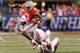 INDIANAPOLIS, IN - DECEMBER 06: Michael Thomas #3 of the Ohio State Buckeyes gets tripped up over Wisconsin Badgers defense in the second quarter of the Big Ten Championship at Lucas Oil Stadium on December 6, 2014 in Indianapolis, Indiana. (Photo by Jo