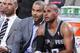 PORTLAND, OR - FEBRUARY 19: Tony Parker #9 and Patty Mills #8 of the San Antonio Spurs talk on the bench during the game against the Portland Trail Blazers on February 19, 2014 at the Moda Center Arena in Portland, Oregon. NOTE TO USER: User expressly ac