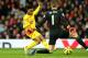MANCHESTER, ENGLAND - DECEMBER 14: Dvid De Gea of Manchester United saves the attempt on goal of Raheem Sterling of Liverpool in a one on one situation during the Barclays Premier League match between Manchester United and Liverpool at Old Trafford on De