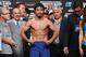 MACAU - NOVEMBER 22: Manny Pacquiao steps on the scales during the official weigh in at The Venetian on November 22, 2014 in Macau. Pacquiao will defend his WBO world welterweight title against Chris Algieri in Macau. (Photo by Chris Hyde/Getty Images)