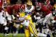 LSU defensive tackle Davon Godchaux (No. 57) tackles former Alabama running back T.J. Yeldon (No. 4).