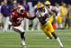 LSU receiver Travin Dural (No. 83) runs away from a Wisconsin defender.