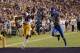 BATON ROUGE, LA - OCTOBER 18: Travin Dural #83 of the LSU Tigers catches a touchdown pass in front of Fred Tiller #3 of the Kentucky Wildcats during the second quarter of a game at Tiger Stadium on October 18, 2014 in Baton Rouge, Louisiana. (Photo by Sta