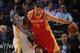OAKLAND, CA - DECEMBER 10: Donatas Motiejunas #20 of the Houston Rockets posts up against Draymond Green #23 of the Golden State Warriors on December 10, 2014 at Oracle Arena in Oakland, California. NOTE TO USER: User expressly acknowledges and agrees tha