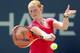 NEW YORK, NY - AUGUST 26: Alison Van Uytvanck of Belgium returns a shot against Varvara Lepchenko of the United States on Day Two of the 2014 US Open at the USTA Billie Jean King National Tennis Center on August 26, 2014 in the Flushing neighborhood of