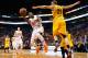 PHOENIX, AZ - JANUARY 13: Eric Bledsoe #2 of the Phoenix Suns puts up a shot against Timofey Mozgov #20 of the Cleveland Cavaliers during the NBA game at US Airways Center on January 13, 2015 in Phoenix, Arizona. NOTE TO USER: User expressly acknowledge