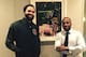 Gardy St. Fleur with Deron Williams in his NYC apartment next to a piece by artist Nathaniel M. Quinn called "Batman."