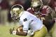 Oct 18, 2014; Tallahassee, FL, USA; Notre Dame Fighting Irish quarterback Everett Golson (5) tries to avoid the sack from Florida State Seminoles defensive tackle Eddie Goldman (90) during the first quarter at Doak Campbell Stadium. Mandatory Credit: Joh