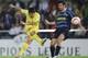CASTELLO DE LA PLANA, SPAIN - APRIL 04: Roman Riquelme (L) of Villarreal shoots past Luis Figo of Inter Milan during the UEFA Champions League Quarter Final Second Leg match between Villarreal and Inter Milan at the Madrigal stadium on April 4, 2006 in C