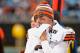 CHARLOTTE, NC - DECEMBER 21: Johnny Manziel #2 of the Cleveland Browns watches from the bench during the second half of a loss to the Carolina Panthers at Bank of America Stadium on December 21, 2014 in Charlotte, North Carolina. (Photo by Grant Halvers