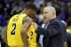 NEWARK, NJ - MARCH 25: Head coach Buzz Williams (R) of the Marquette Golden Eagles talks with Vander Blue #2 of the Marquette Golden Eagles after a play against the North Carolina Tar Heels during the first half the east regional semifinal of the 2011 NC