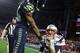 Feb 1, 2015; Glendale, AZ, USA; Seattle Seahawks cornerback Richard Sherman (left) shakes hands with New England Patriots quarterback Tom Brady (12) after Super Bowl XLIX at University of Phoenix Stadium. Mandatory Credit: Mark J. Rebilas-USA TODAY Sports