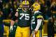 GREEN BAY, WI - DECEMBER 08: Aaron Rodgers #12 and Bryan Bulaga #75 of the Green Bay Packers reacts against the Atlanta Falcons at Lambeau Field on December 8, 2014 in Green Bay, Wisconsin. (Photo by Kevin C. Cox/Getty Images)