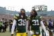 GREEN BAY, WI - JANUARY 11: Tramon Williams #38 and Davon House #31 of the Green Bay Packers walk off the field after the Packers defeat the Dallas Cowboys 26-21 during the 2015 NFC Divisional Playoff game at Lambeau Field on January 11, 2015 in Green