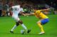 STOCKHOLM, SWEDEN - NOVEMBER 14: Wilfried Zaha of England in action with Behrangt Safari of Sweden during the international friendly match between Sweden and England at the Friends Arena on November 14, 2012 in Stockholm, Sweden. (Photo by Michael Regan