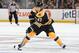 BOSTON, MA - FEBRUARY 7: Torey Krug #47 of the Boston Bruins handles the puck against the New York Islanders at the TD Garden on February 7, 2015 in Boston, Massachusetts. (Photo by Steve Babineau/NHLI via Getty Images)