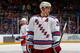 UNIONDALE, NY - JANUARY 27: Derek Stepan #21 of the New York Rangers skates against the New York Islanders at Nassau Veterans Memorial Coliseum on January 27, 2015 in Uniondale, New York. The New York Islanders defeated the New York Rangers 4-1. (Photo