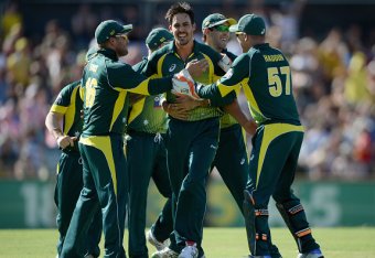 PERTH, AUSTRALIA - FEBRUARY 01:  Mitchell Johnson of Australia celebrates with teammates after bowling out England captain Eoin Morgan during the final match of the Carlton Mid One Day International series between Australia and England at WACA on February