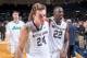 Jan 3, 2015; South Bend, IN, USA; Notre Dame Fighting Irish guard Pat Connaughton (24) and guard Jerian Grant (22) leave the court after Notre Dame defeated the Georgia Tech Yellow Jackets 83-76 in double overtime at the Purcell Pavilion. Mandatory Credit