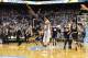 Jan 5, 2015; Chapel Hill, NC, USA; Notre Dame Fighting Irish guard Demetrius Jackson (11) and guard Jerian Grant (22) jump up at center court as North Carolina Tar Heels forward J.P. Tokoto (13) walks off after the game. The Fighting Irish defeated the Ta
