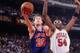 CHICAGO - 1991: Mark Price #25 of the Cleveland Cavaliers shoots a layup against Horace Grant #54 of the Chicago Bulls during a 1991 NBA game at the United Center in Chicago Illinois. NOTE TO USER: User expressly acknowledges that, by downloading and or